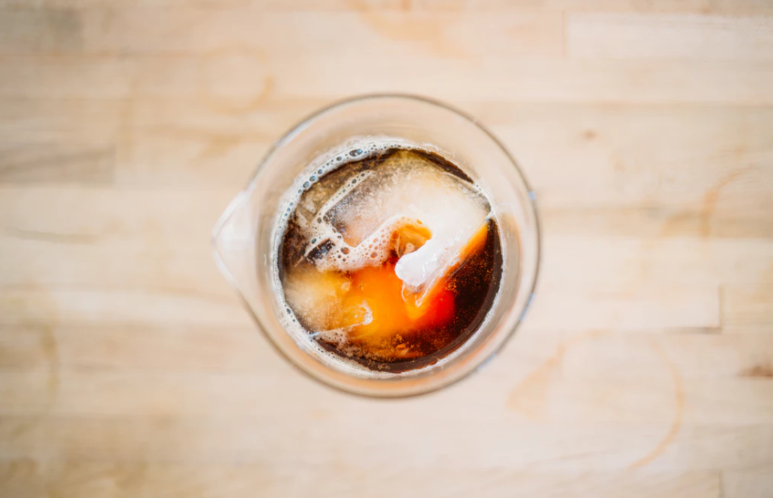 Butcher block countertop with iced drink on top