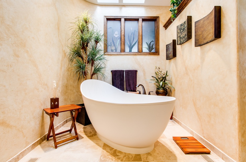 Bathtub in a bathroom with plants